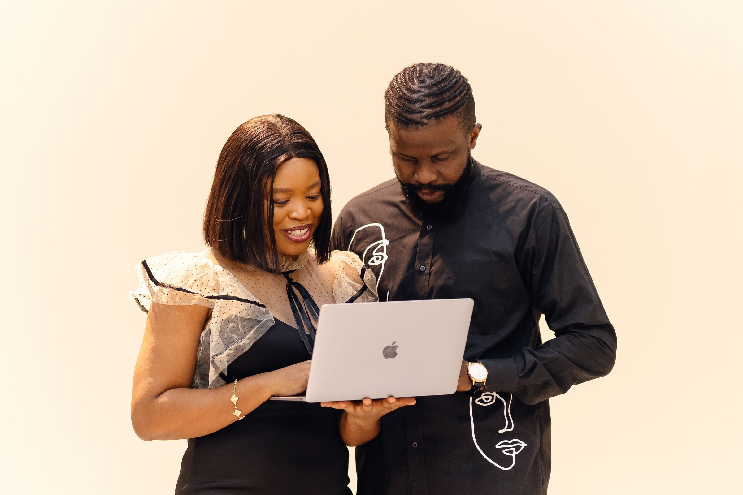 African businessman and businesswoman collaborating in Lagos office