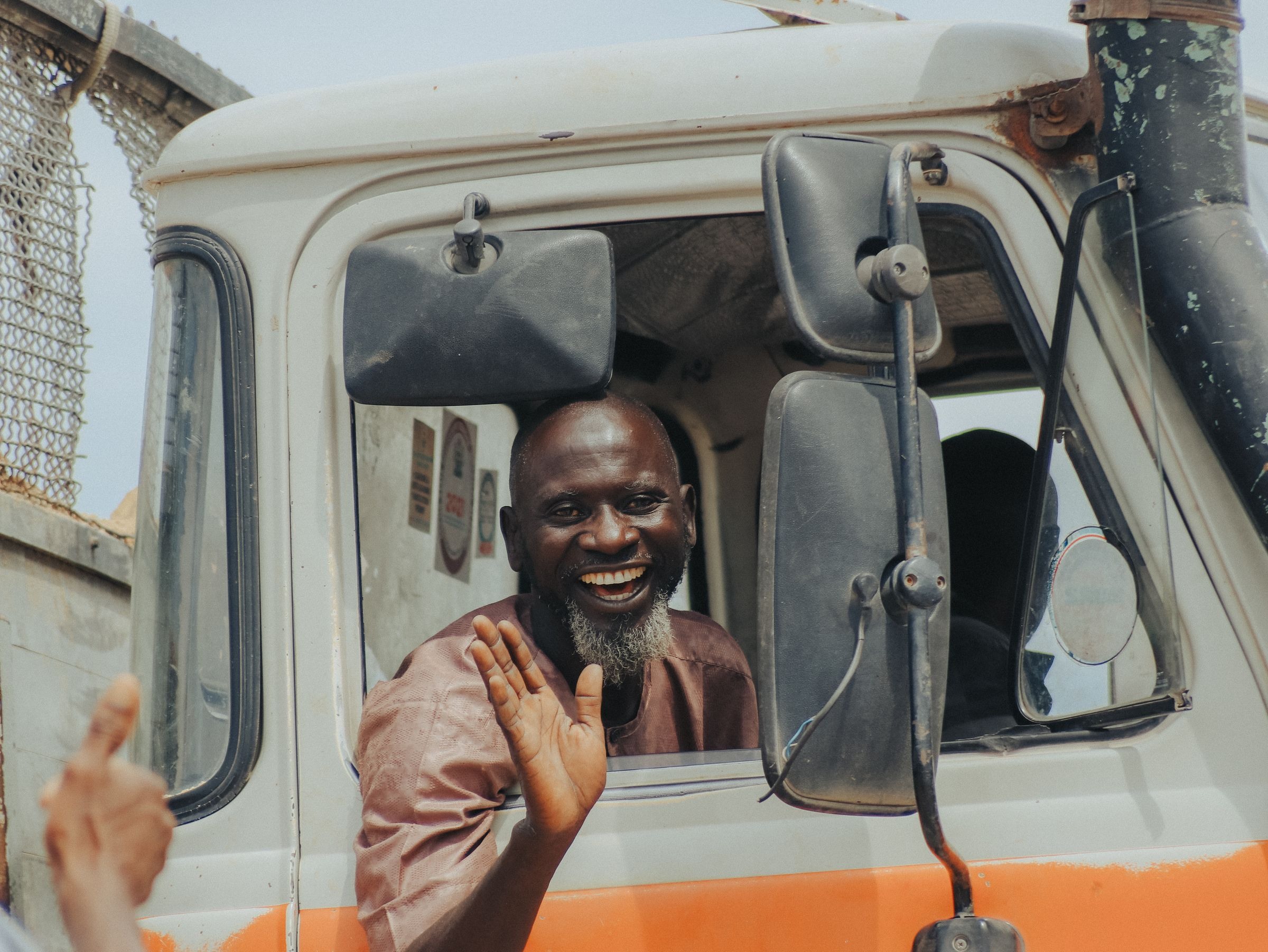 Professional truck driver at vehicle window