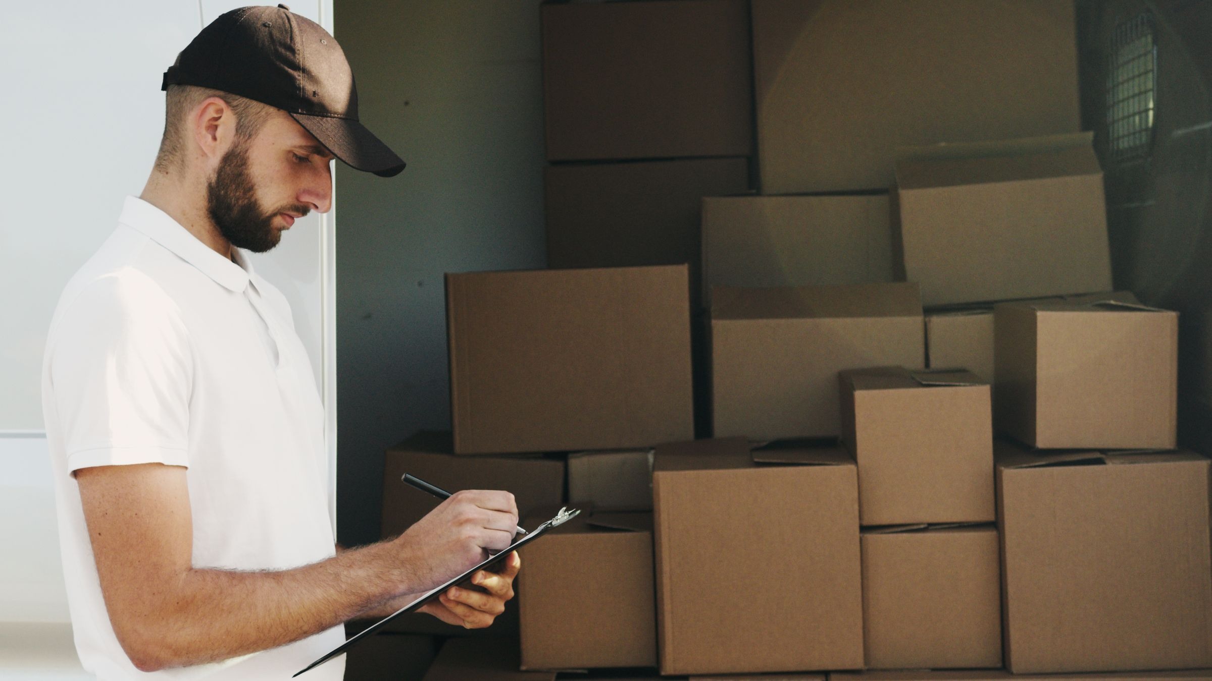 Delivery collection paperwork beside cargo