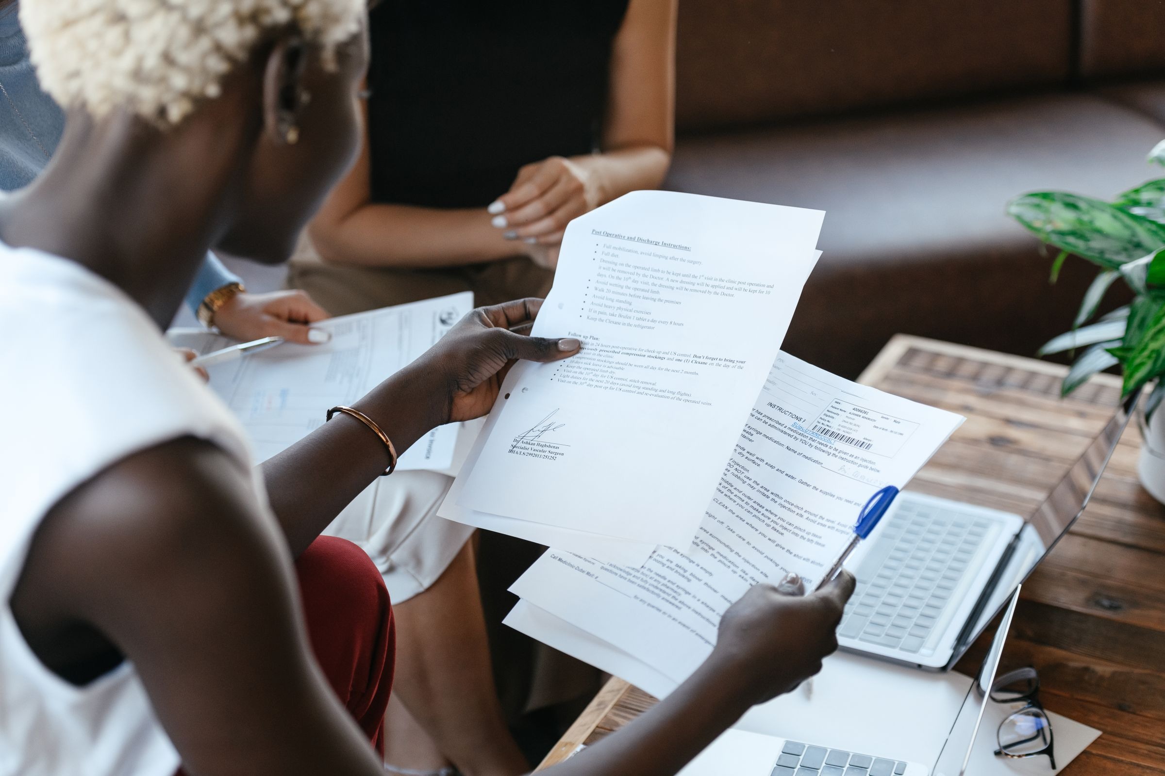Black professional women reviewing paperwork