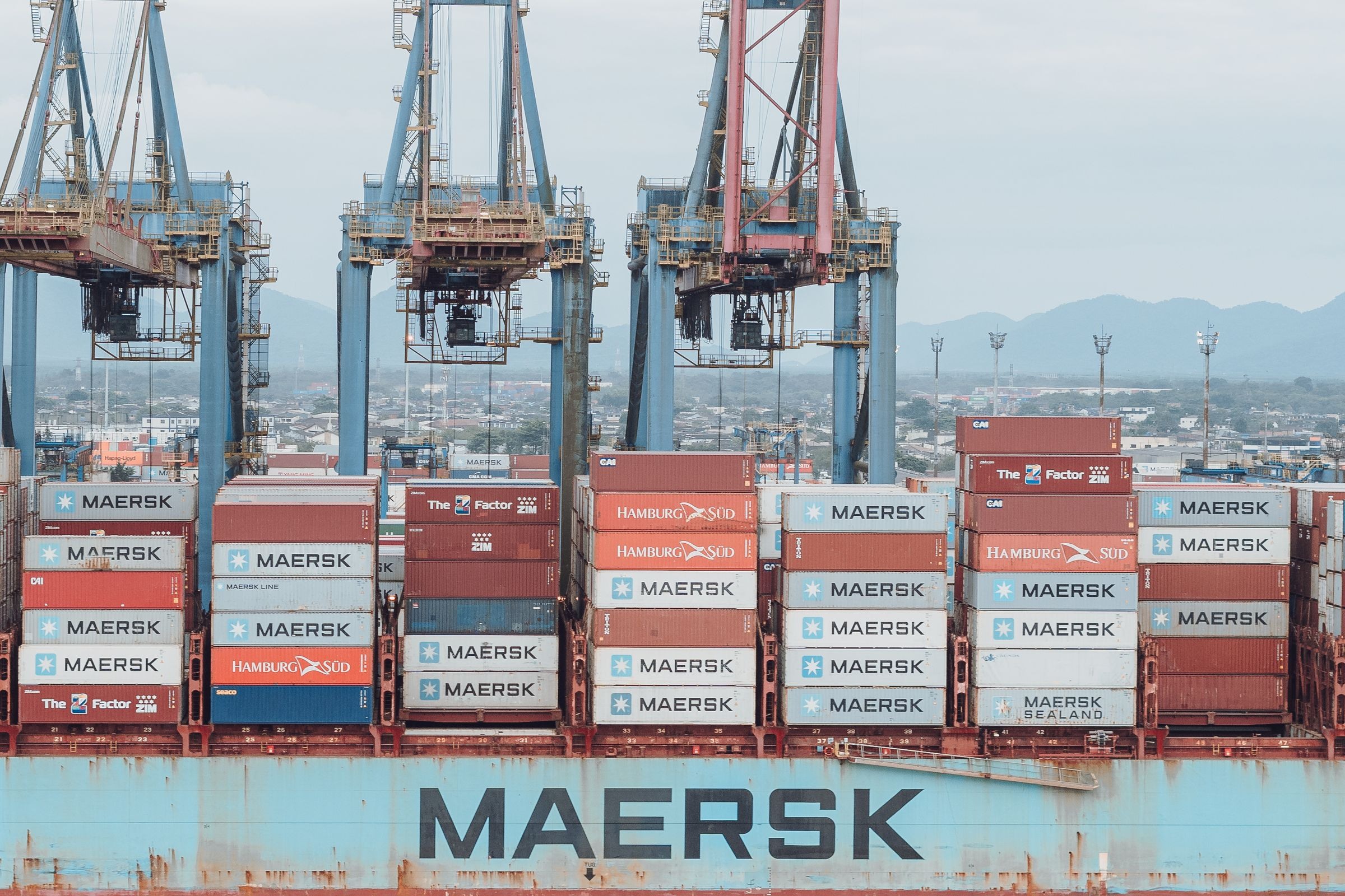 Container ship and cranes at an international freight terminal