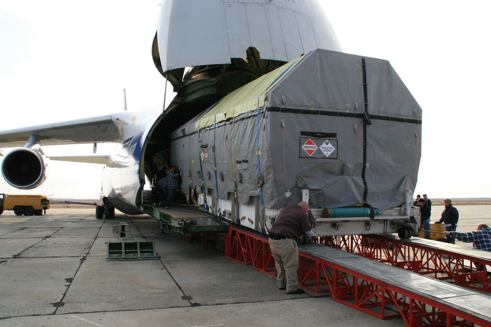 Air cargo being loaded through an aircraft cargo door