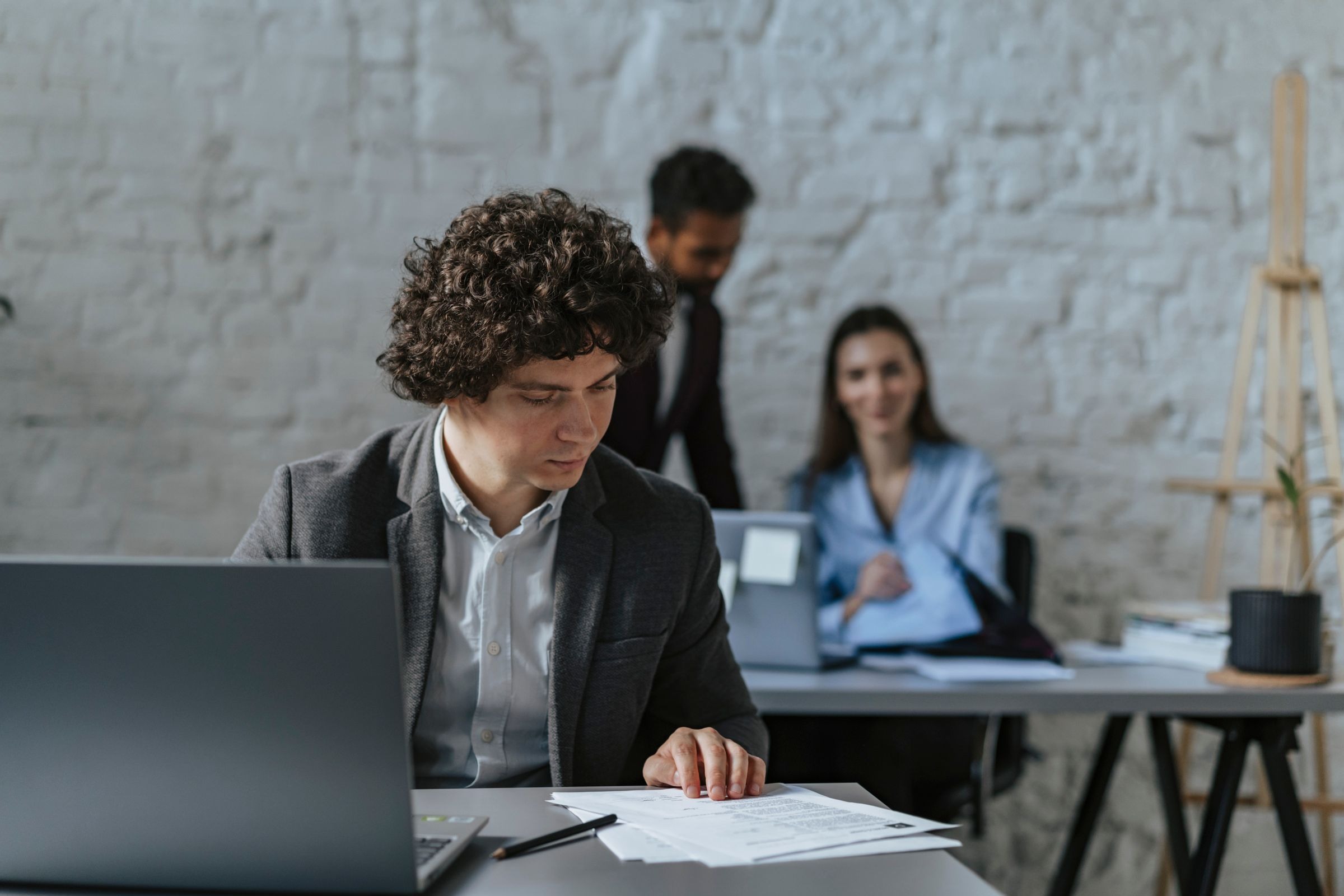 Business professionals reviewing shipment documents