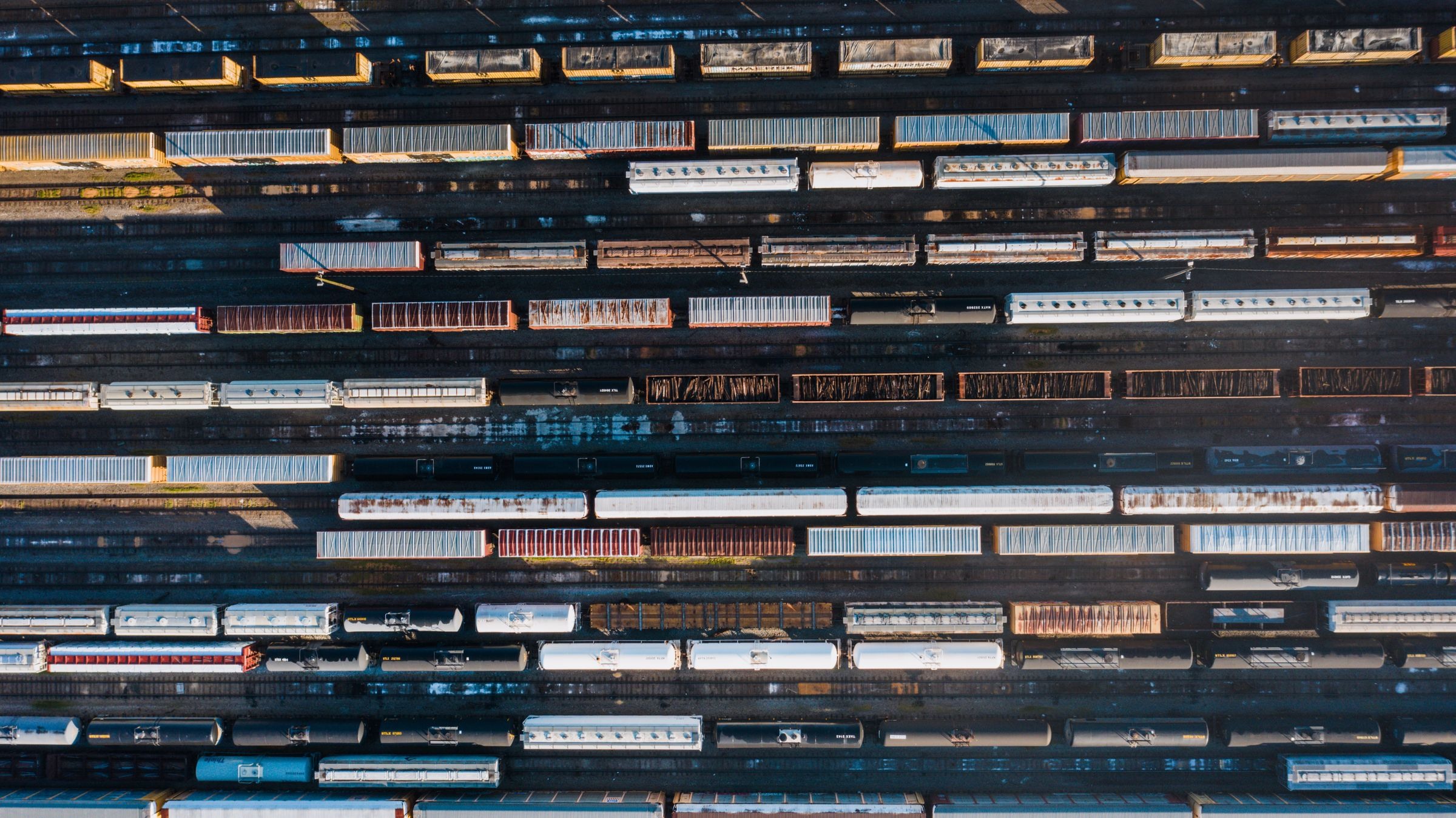 Aerial view of freight wagons and containers in a rail yard