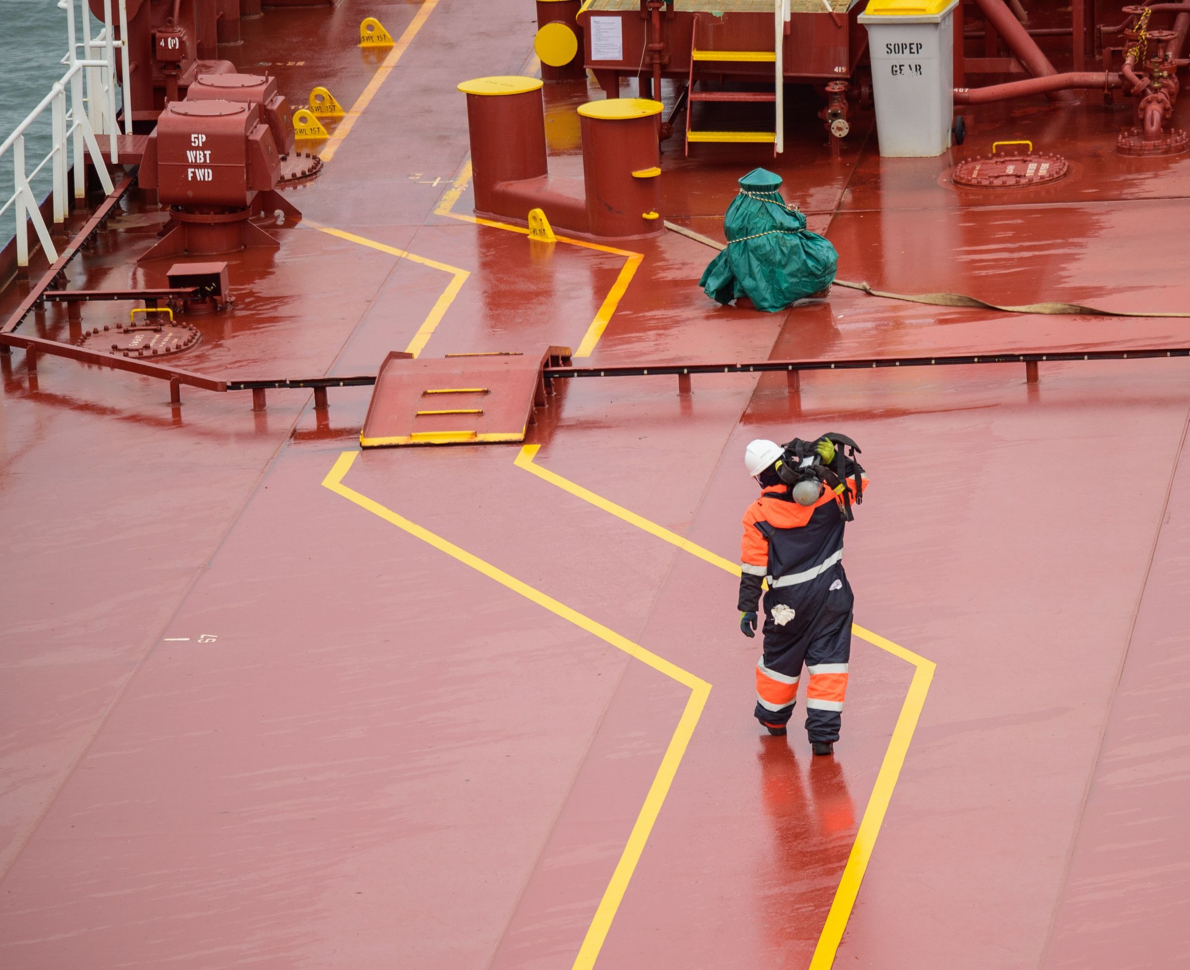 Cargo ship workers wearing protective equipment