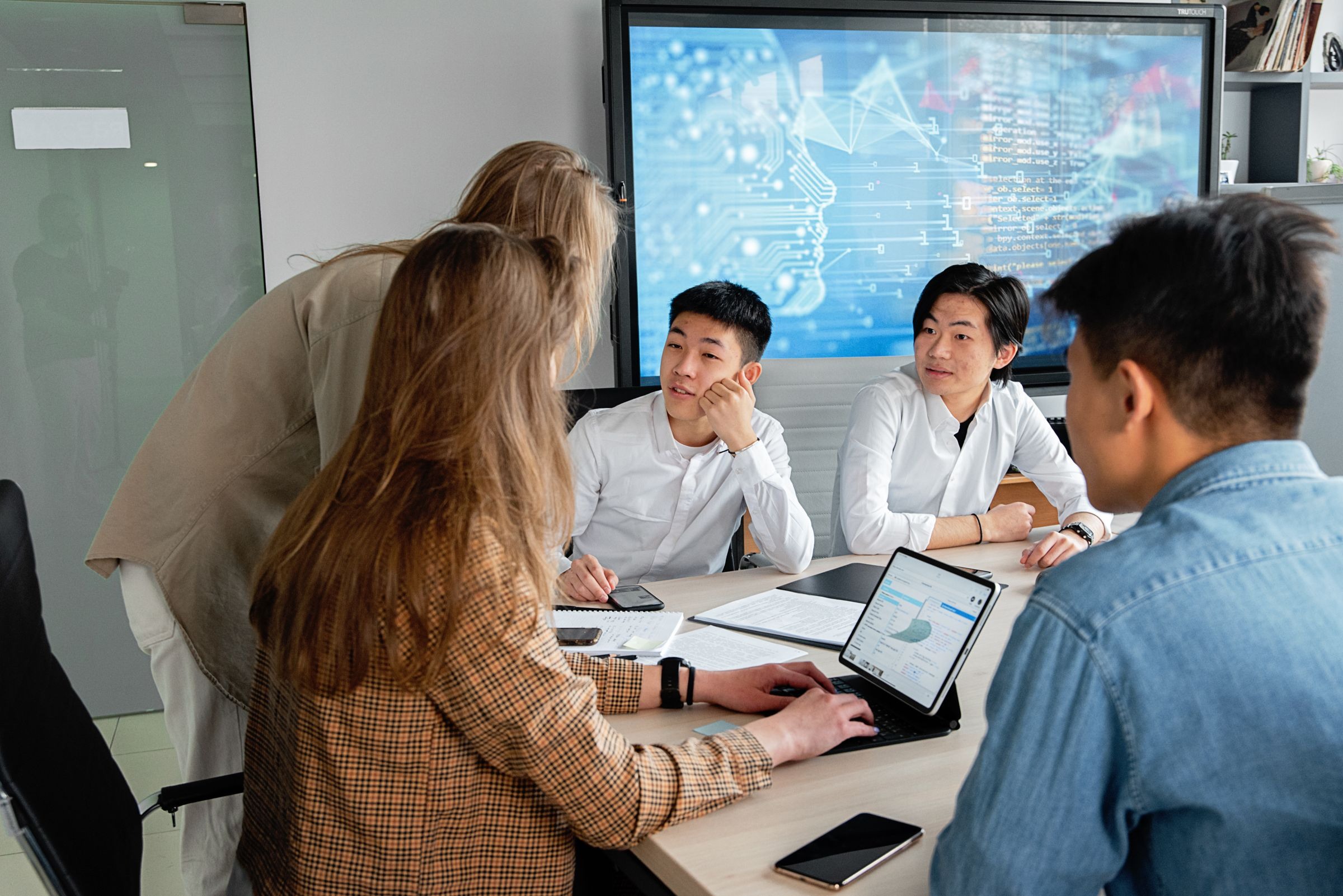 Professional team reviewing information together