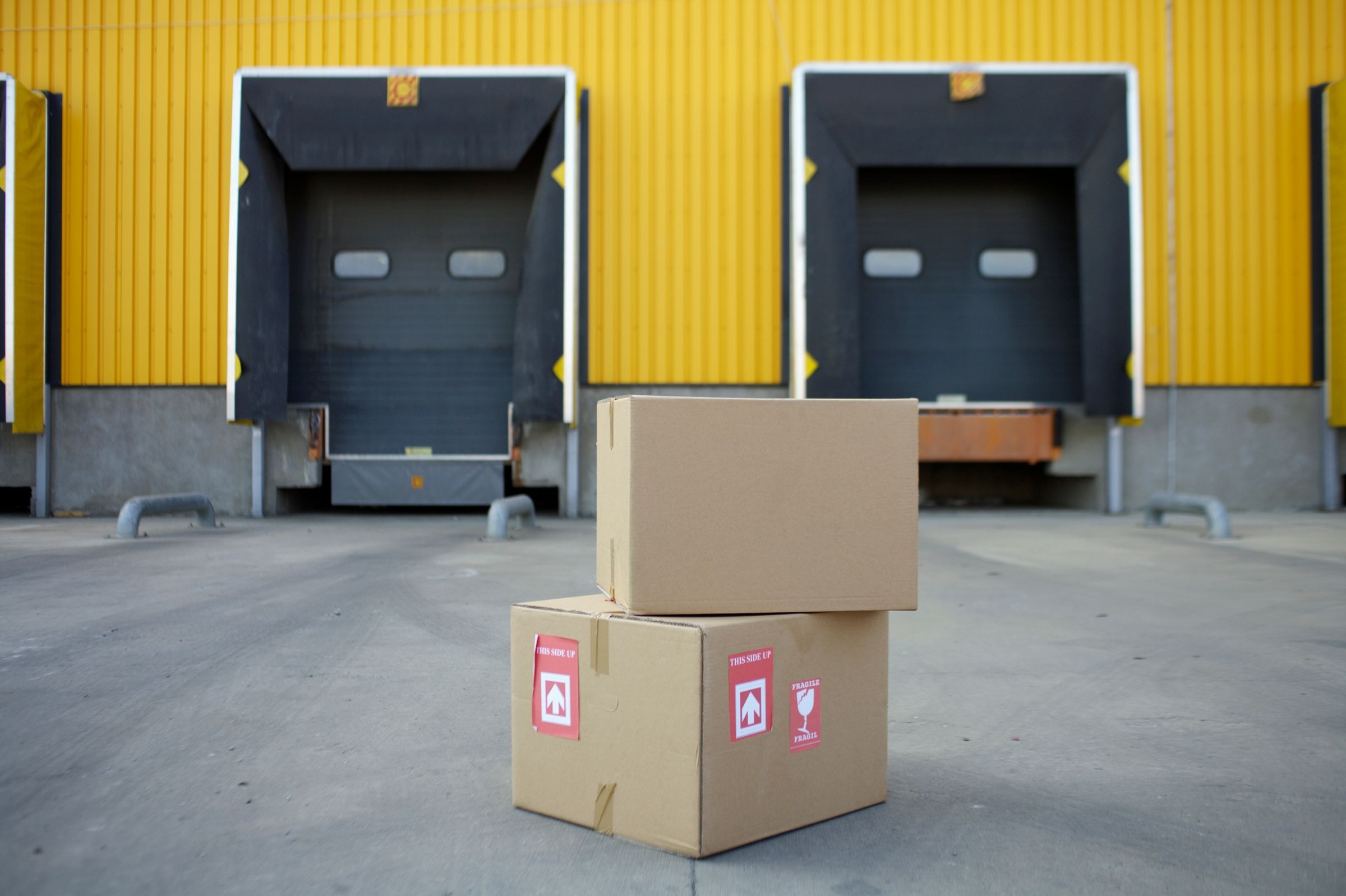 Plain cartons at a warehouse loading dock