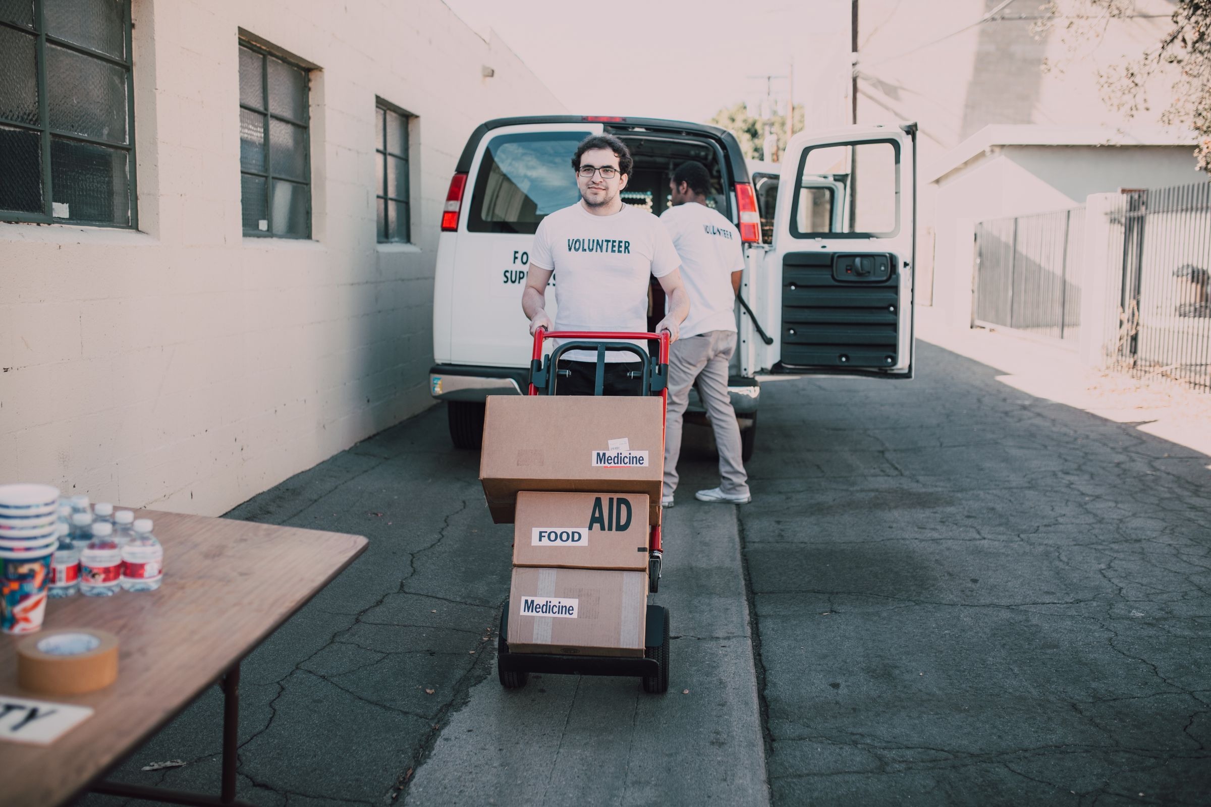 Relief supplies being loaded into a delivery van
