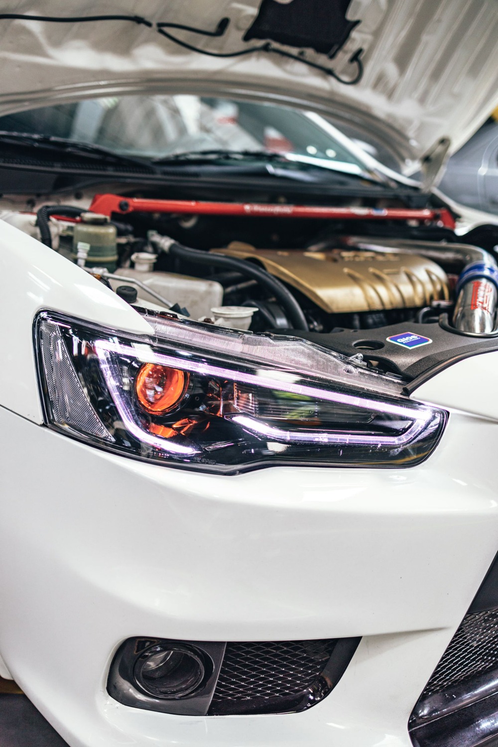 Modern car engine under open hood