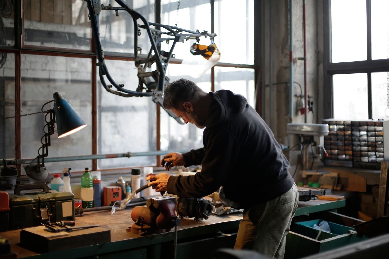 Mechanic working on metal engine component