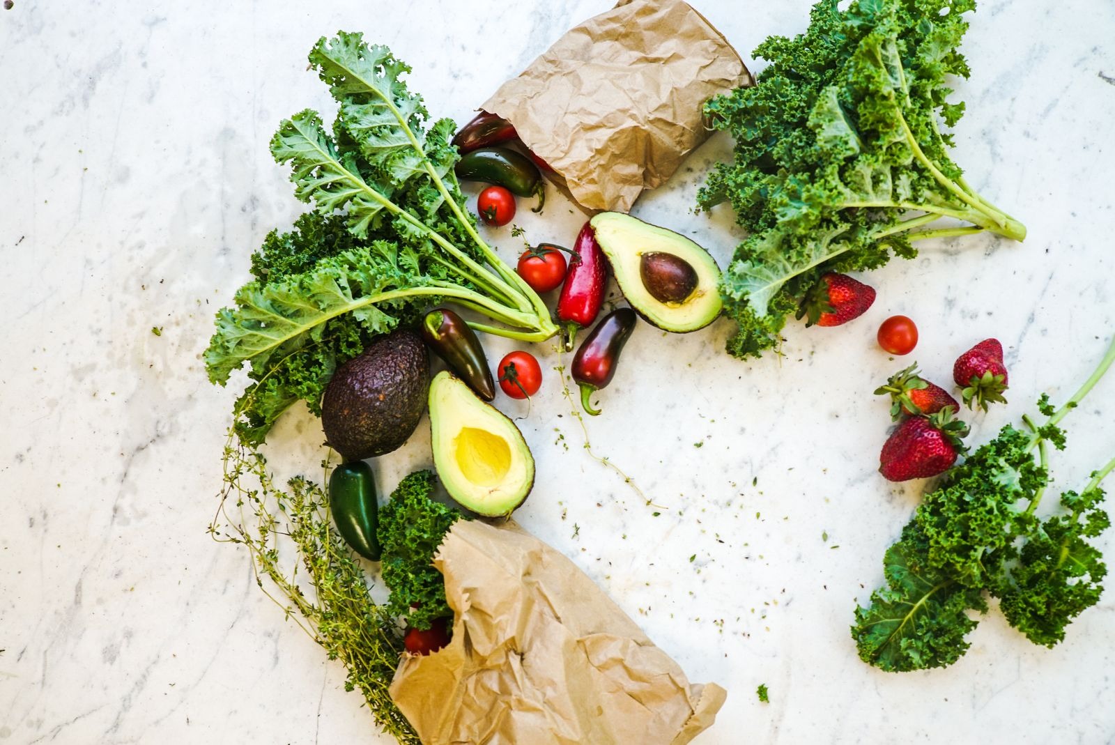 Fresh mixed produce including avocado