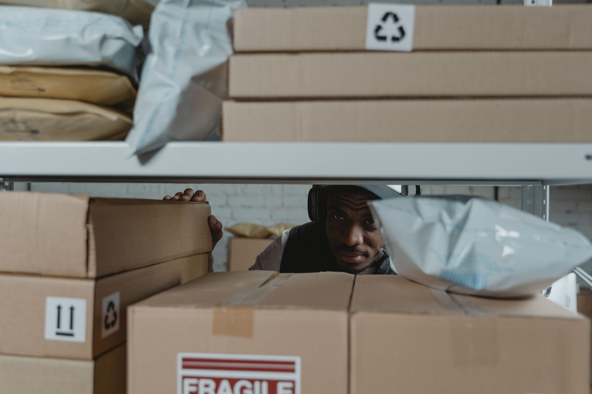 Warehouse worker inspecting packaged cargo