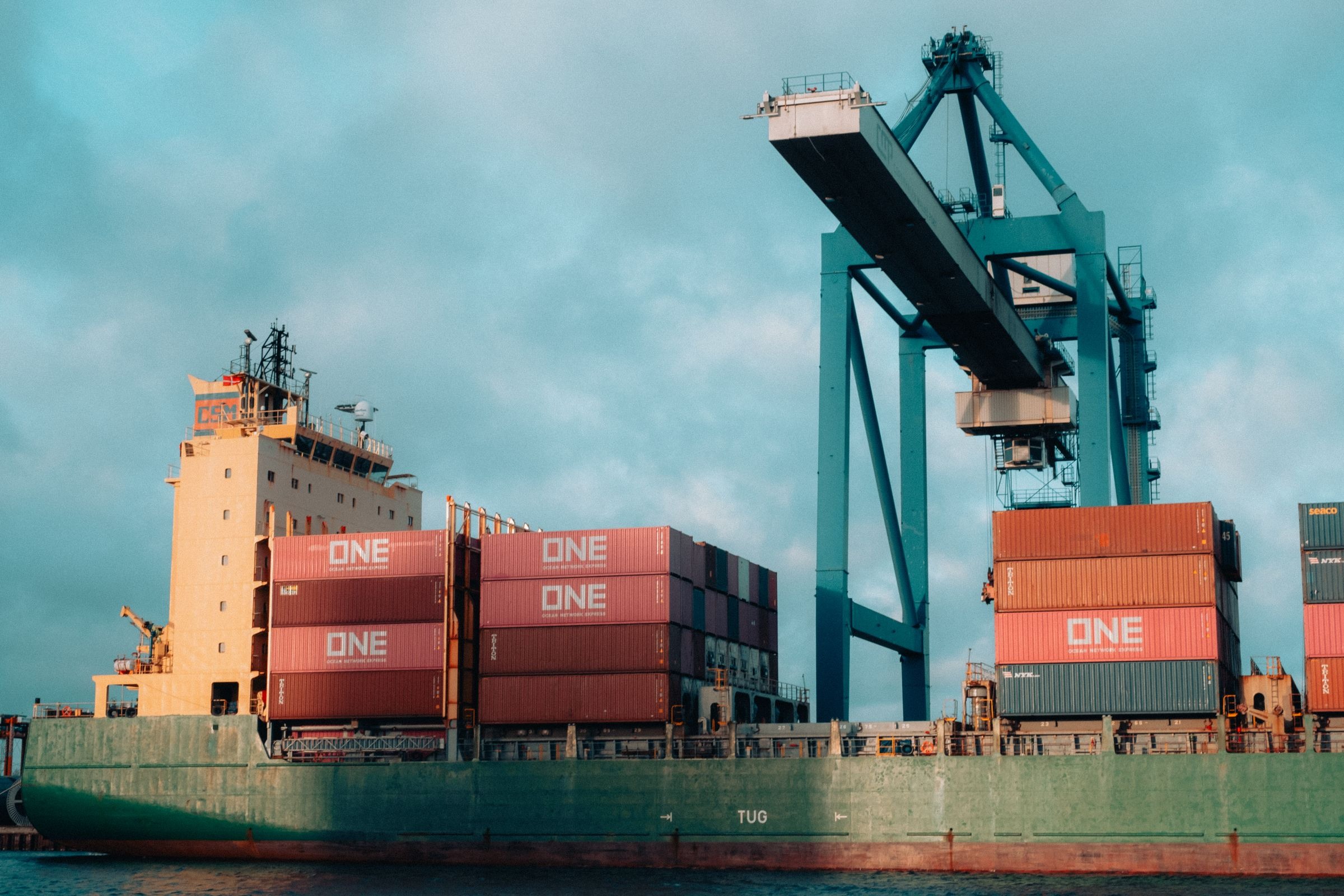 Container freight being handled at a port terminal