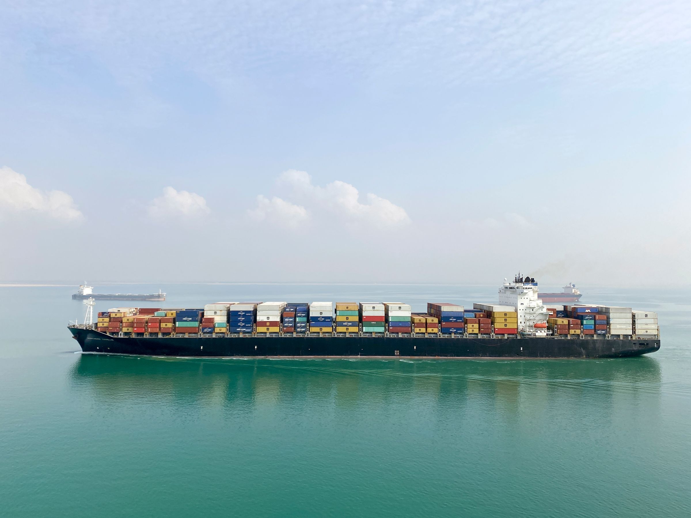 Loaded container vessel sailing at sea