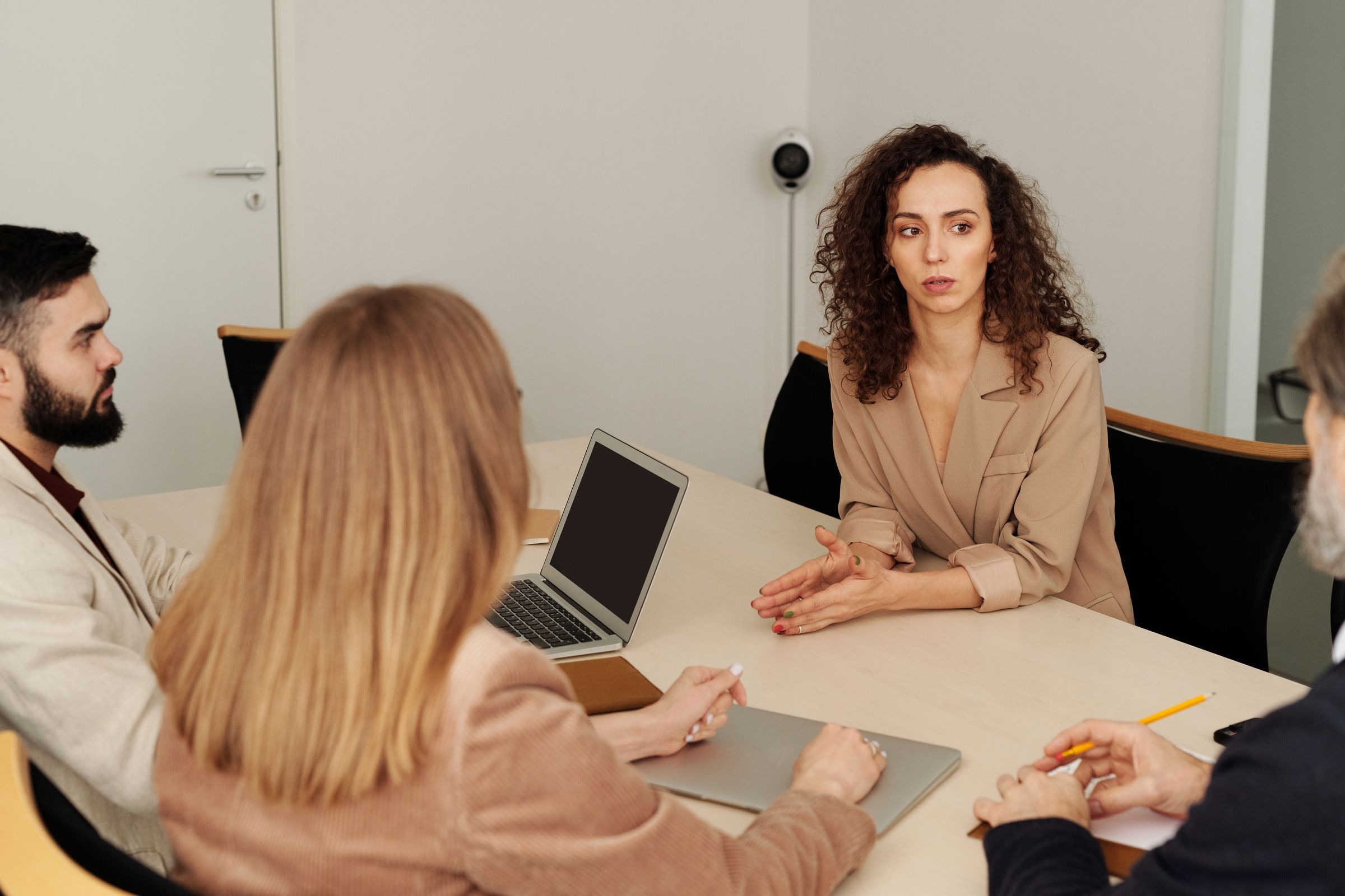 Diverse professional team collaborating at an office meeting