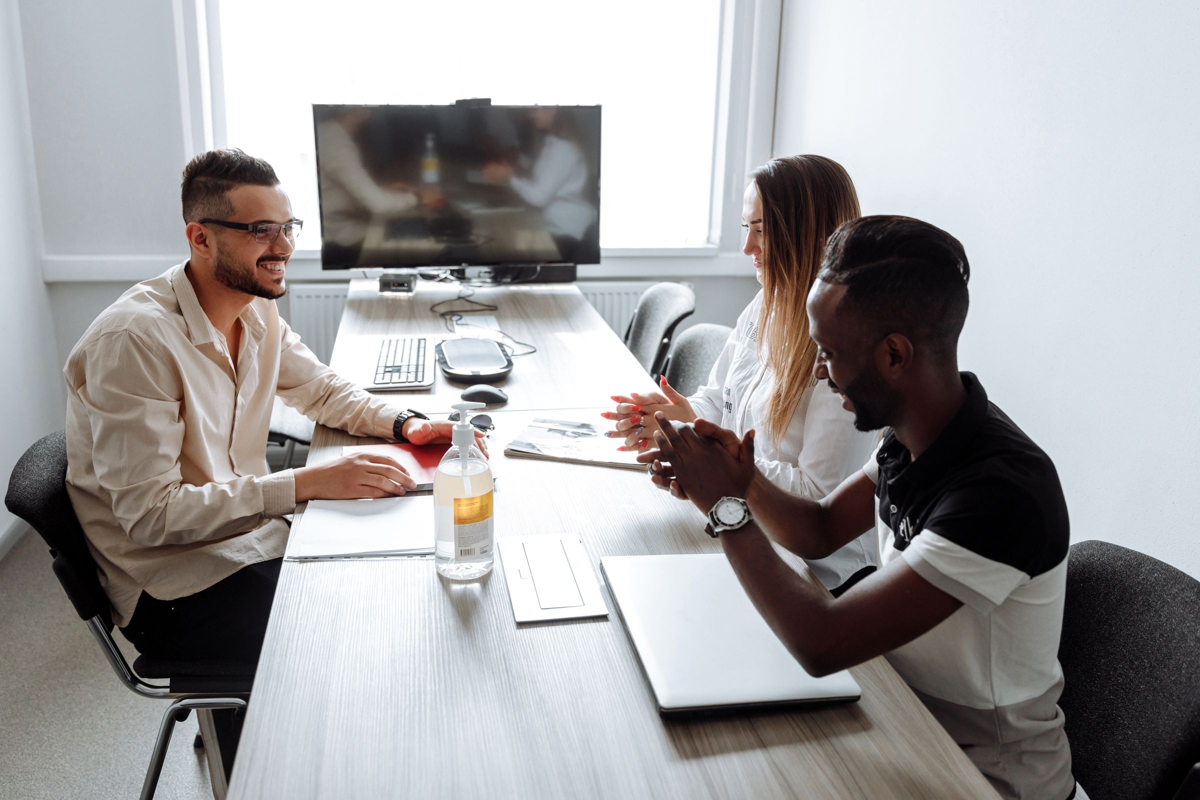 Professionals coordinating around a meeting table
