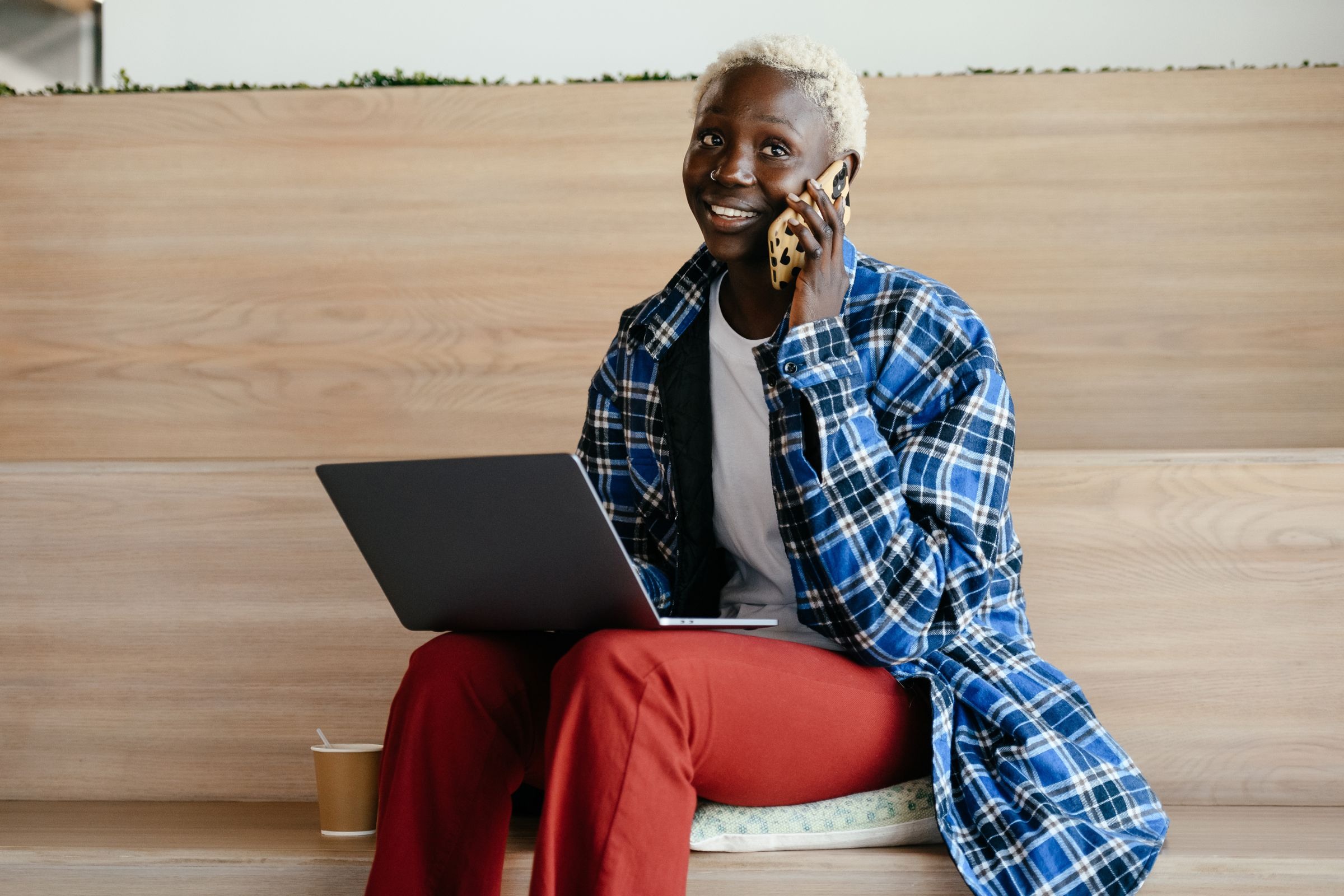 Professional on phone with laptop