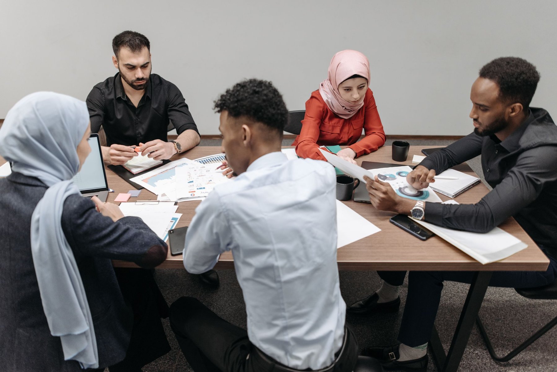Professional team reviewing shipment information